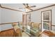 A dining room with hardwood floors, wood trim, and a glass table at 4481 Windsor Oaks Dr, Marietta, GA 30066