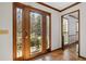 Elegant leaded glass front door featuring sidelights and hardwood floor at 4481 Windsor Oaks Dr, Marietta, GA 30066