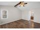 Bright bedroom featuring hardwood floors, a vaulted ceiling and a view to the en suite bathroom at 4481 Windsor Oaks Dr, Marietta, GA 30066