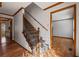 Inviting foyer with hardwood floors, wooden trim and a classic staircase with iron spindles at 4481 Windsor Oaks Dr, Marietta, GA 30066