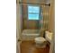 This bathroom has a shower/tub combo with tile surround at 818 Burchill Sw St, Atlanta, GA 30310