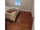 This bedroom has hardwood floors and an area rug at 818 Burchill Sw St, Atlanta, GA 30310