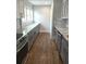 Updated kitchen area with long countertops and updated cabinets at 818 Burchill Sw St, Atlanta, GA 30310