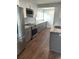 Gray and white kitchen design featuring stainless steel appliances and granite counters at 818 Burchill Sw St, Atlanta, GA 30310