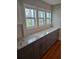 Kitchen featuring gray cabinets, granite countertops and a tiled backsplash at 818 Burchill Sw St, Atlanta, GA 30310