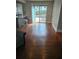 Living room with hardwood floors leads to a deck with outdoor seating at 818 Burchill Sw St, Atlanta, GA 30310