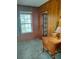 Sunroom features wood paneling, tile flooring, and natural light at 818 Burchill Sw St, Atlanta, GA 30310