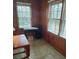 Cozy sunroom with natural light, desk, and wood paneling at 818 Burchill Sw St, Atlanta, GA 30310