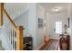 Inviting hallway with hardwood floors, a staircase, and neutral wall colors at 108 Trailside Cir, Hiram, GA 30141