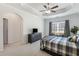 Bright main bedroom with white walls, a ceiling fan, window bench, and furniture with black hardware at 108 Trailside Cir, Hiram, GA 30141