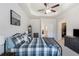 Bright main bedroom featuring carpeted floors, a ceiling fan, white walls, and trim, and access to the closet at 108 Trailside Cir, Hiram, GA 30141