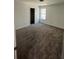 Carpeted bedroom featuring neutral walls and plenty of natural light at 1335 Tumblerock Way, Loganville, GA 30052