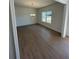 Open dining room features wood-look floors and a stylish chandelier at 1335 Tumblerock Way, Loganville, GA 30052