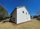 Exterior shot of a two story home featuring white siding and blue skies at 1335 Tumblerock Way, Loganville, GA 30052