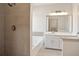 Bright bathroom with tiled shower, soaker tub, vanity, and walk-in closet at 275 Carriage Chase, Fayetteville, GA 30214