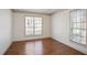 Bedroom featuring hardwood floors and a large window at 275 Carriage Chase, Fayetteville, GA 30214