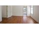 Bedroom featuring hardwood floors, neutral walls, and a view to an en suite bathroom at 275 Carriage Chase, Fayetteville, GA 30214