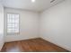 This bedroom features hardwood floors, a window with blinds, and fresh paint at 275 Carriage Chase, Fayetteville, GA 30214