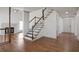 Inviting foyer with hardwood floors, staircase, and access to living areas at 275 Carriage Chase, Fayetteville, GA 30214