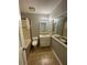 Functional bathroom with a tub, vanity, and ample lighting at 404 Prince Of Wales, Stone Mountain, GA 30083