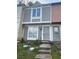 Exterior view of townhome entrance with concrete steps leading to the front door at 404 Prince Of Wales, Stone Mountain, GA 30083