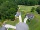 Aerial view of the property showcasing its location within a well-maintained neighborhood and golf course at 49 Inverness Ct, Hiram, GA 30141