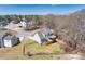 Aerial view showcasing a well-maintained home with deck overlooking a large fenced backyard at 49 Inverness Ct, Hiram, GA 30141