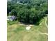 Aerial view of the golf course and neighborhood, showcasing the lush green surroundings at 49 Inverness Ct, Hiram, GA 30141