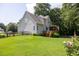 Beautiful backyard with expansive lawn, wooden fence, and a welcoming deck, ideal for entertaining guests at 49 Inverness Ct, Hiram, GA 30141