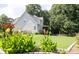 Beautiful backyard with a deck, decorative wooden fence, and colorful landscaping at 49 Inverness Ct, Hiram, GA 30141