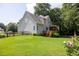 Spacious backyard with a wooden deck, wooden fence, and lush green lawn at 49 Inverness Ct, Hiram, GA 30141