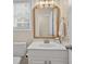 Chic bathroom with an ornate mirror, vanity, and ample natural light at 49 Inverness Ct, Hiram, GA 30141