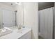 Well-lit bathroom featuring a modern sink, large mirror, and convenient shower at 49 Inverness Ct, Hiram, GA 30141