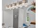 Bathroom view with dual sinks, stylish mirror, shower, and natural light from an arched window at 49 Inverness Ct, Hiram, GA 30141