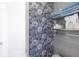Stylish bathroom with gray floral wallpaper at 49 Inverness Ct, Hiram, GA 30141
