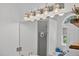 Elegant bathroom with large mirror, vanity lighting, and soaking tub at 49 Inverness Ct, Hiram, GA 30141