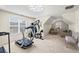 Bright bonus room featuring a cozy seating area, home gym, and a sunlit window at 49 Inverness Ct, Hiram, GA 30141