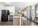 Bright breakfast nook with stainless steel appliances, granite countertops, and an open layout to the living area at 49 Inverness Ct, Hiram, GA 30141
