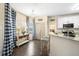 Charming breakfast nook with blue-checkered curtains, natural light, and granite countertops at 49 Inverness Ct, Hiram, GA 30141