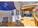 Inviting deck area with comfortable seating, a dining table, and stylish decor, perfect for outdoor relaxation at 49 Inverness Ct, Hiram, GA 30141