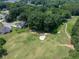 Aerial view of backyard onto the golf course offering a serene and picturesque setting for outdoor living at 49 Inverness Ct, Hiram, GA 30141