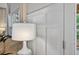 Hallway with white wood-paneled wainscoting and natural light at 49 Inverness Ct, Hiram, GA 30141