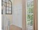 Hallway with wainscoting, view of natural light, and carpeted floor at 49 Inverness Ct, Hiram, GA 30141