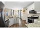 Bright kitchen with stainless steel appliances, granite countertops, and a charming breakfast nook with natural light at 49 Inverness Ct, Hiram, GA 30141