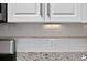 Contemporary kitchen backsplash and granite countertops at 49 Inverness Ct, Hiram, GA 30141