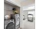 Convenient laundry area with side by side washer and dryer, with nearby exercise area at 49 Inverness Ct, Hiram, GA 30141