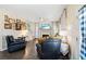 Comfortable living room with fireplace, ceiling fan, dark, solid wood floors and neutral paint at 49 Inverness Ct, Hiram, GA 30141