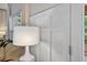 Bright living room boasting wainscoting, a lamp, and comfortable furnishings at 49 Inverness Ct, Hiram, GA 30141