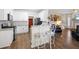 Modern kitchen with stainless steel appliances and adjacent breakfast nook with bar seating at 49 Inverness Ct, Hiram, GA 30141