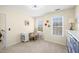 Bright office space with desk, shelves, and natural light from multiple windows at 49 Inverness Ct, Hiram, GA 30141